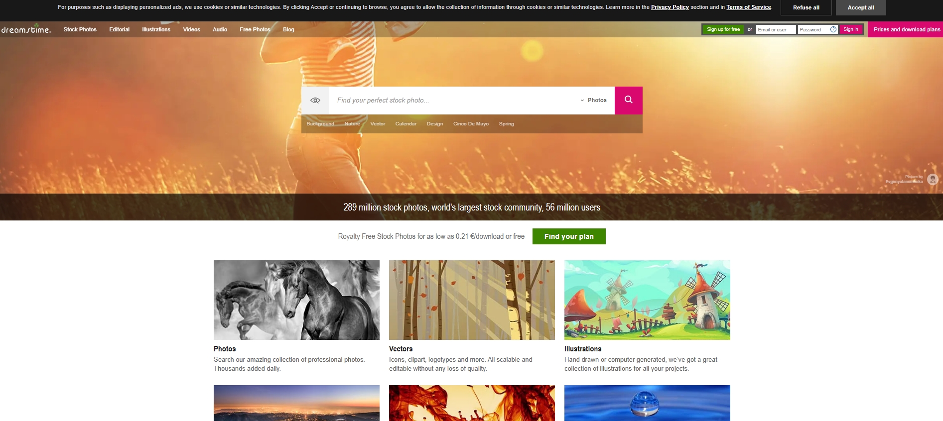 Dreamstime homepage featuring a search bar, categories, and images of horses, trees, and cartoon windmills