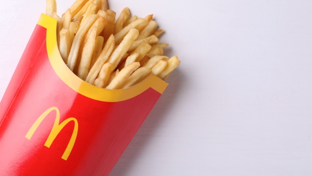 A bright McDonald’s fries box with yellow arches shows how color grabs attention in digital marketing