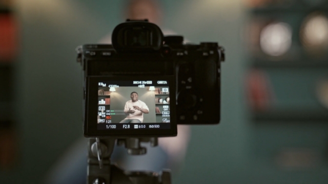 Camera recording a person presenting, showing YouTube formats that work for B2B marketing