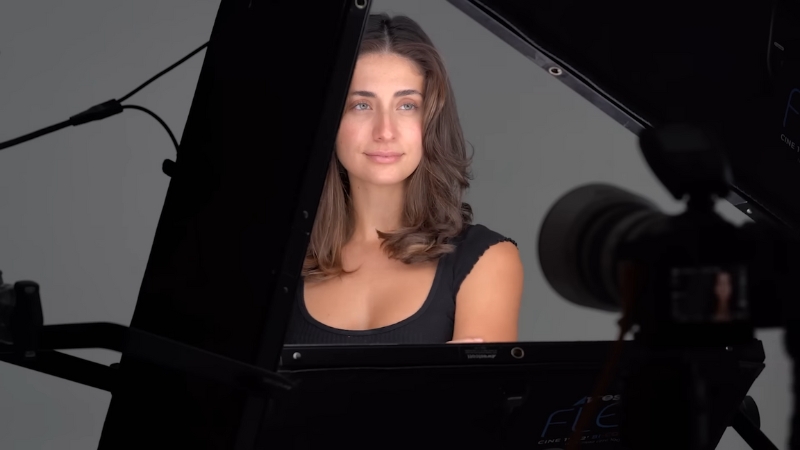 Woman sitting in a studio setup with soft, even lighting for a clear profile photo