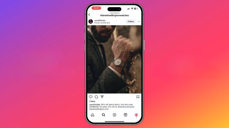 Smartphone displaying an Instagram post featuring a luxury watch as an example of visual marketing