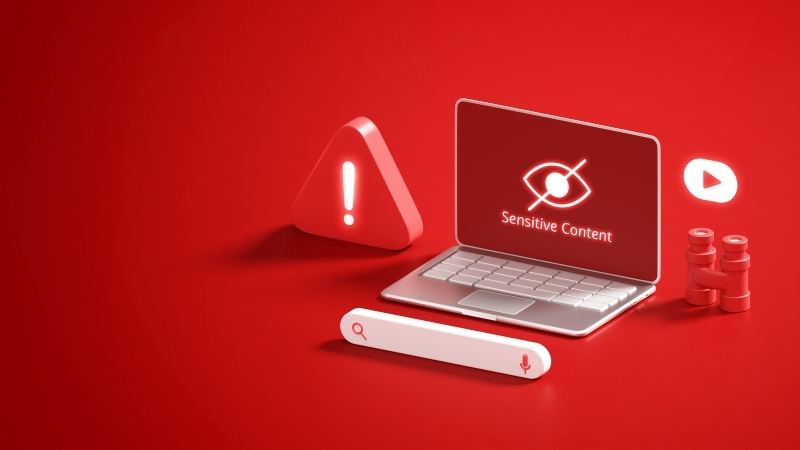 Laptop showing a sensitive content warning that represents blocked or restricted material on an NSFW website