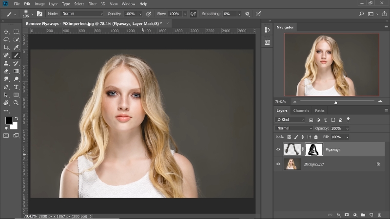 Portrait in Photoshop with stray hairs being cleaned for a polished headshot