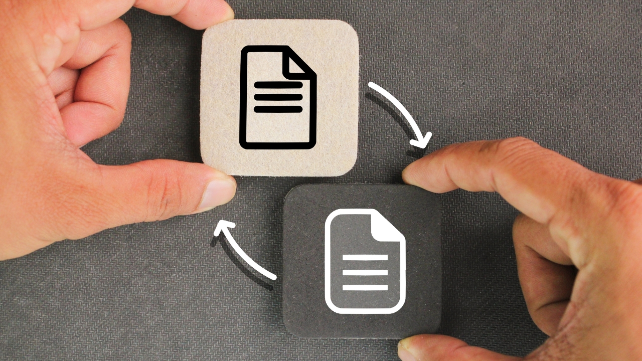 Hands move two file icons to show a file transfer process